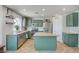 Charming kitchen featuring green cabinets, granite countertops and stainless appliances at 412 Orchid Oasis Ave, North Las Vegas, NV 89031