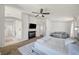 Bright main bedroom has a ceiling fan, carpeted floors, sitting area, and ensuite at 412 Orchid Oasis Ave, North Las Vegas, NV 89031