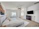 Large main bedroom features ensuite bathroom, ceiling fan, and carpeted floors at 412 Orchid Oasis Ave, North Las Vegas, NV 89031