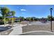 Community park includes a picnic shelter, playground equipment, seating, and a lamppost at 412 Orchid Oasis Ave, North Las Vegas, NV 89031