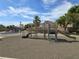 Neighborhood playground with climbing structure and surrounding desert landscaping and play areas at 412 Orchid Oasis Ave, North Las Vegas, NV 89031