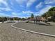 Community playground featuring a covered picnic area, play equipment and desert landscaping at 412 Orchid Oasis Ave, North Las Vegas, NV 89031