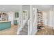 Staircase that connects the kitchen to the upper floor and also displays decorative shelving at 412 Orchid Oasis Ave, North Las Vegas, NV 89031