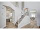 Staircase with carpeted steps and white railings leading to the upper level at 412 Orchid Oasis Ave, North Las Vegas, NV 89031