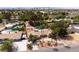 This spacious backyard has a swimming pool, desert landscaping, and views of the city skyline at 4219 E Pinecrest Cir, Las Vegas, NV 89121