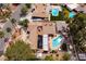 An aerial view of the property highlights a swimming pool, solar panels, and lush landscaping at 4219 E Pinecrest Cir, Las Vegas, NV 89121