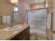 Bathroom with a single sink vanity, a white toilet, and a walk-in shower with a sliding glass door at 4219 E Pinecrest Cir, Las Vegas, NV 89121