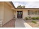 Inviting front entrance featuring a decorative door with sidelights and manicured landscaping at 4219 E Pinecrest Cir, Las Vegas, NV 89121