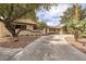 Attractive single-Gathering home showcases a circular driveway, mature trees, and desert landscaping at 4219 E Pinecrest Cir, Las Vegas, NV 89121