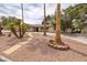 Charming single-story home features desert landscaping, mature trees, and a covered parking area at 4219 E Pinecrest Cir, Las Vegas, NV 89121
