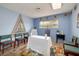 Room featuring light blue walls, a mosaic window, accent lighting, and tiled floors at 4219 E Pinecrest Cir, Las Vegas, NV 89121