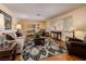 Comfortable living room features hardwood floors, a stylish area rug, and ample seating at 4219 E Pinecrest Cir, Las Vegas, NV 89121