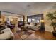 Spacious living room showcasing comfortable seating, a cozy fireplace, and seamless integration with the kitchen, perfect for entertaining at 4219 E Pinecrest Cir, Las Vegas, NV 89121