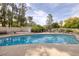 Relaxing pool area surrounded by lush landscaping, creating a serene and private backyard oasis at 4219 E Pinecrest Cir, Las Vegas, NV 89121