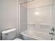 This bathroom features a clean, all-white shower and tub, offering a bright and modern feel at 4725 Basilicata Ln # 204, North Las Vegas, NV 89084