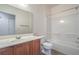 Cozy bathroom featuring a sink and vanity area adjacent to the toilet and bathtub at 4725 Basilicata Ln # 204, North Las Vegas, NV 89084
