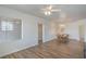 Open floor plan with a dining area, wood floors and natural light from the window at 4725 Basilicata Ln # 204, North Las Vegas, NV 89084