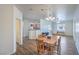 Dining area, hardwood floors, with open access to the kitchen and living areas at 4725 Basilicata Ln # 204, North Las Vegas, NV 89084