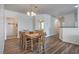 Dining area with a traditional wooden table set, wood floors and neutral wall paint at 4725 Basilicata Ln # 204, North Las Vegas, NV 89084