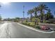Gated community entrance with palm trees and well-maintained landscaping at 4725 Basilicata Ln # 204, North Las Vegas, NV 89084