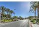 Gated community entrance with palm trees and well-maintained landscaping at 4725 Basilicata Ln # 204, North Las Vegas, NV 89084