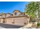 Charming townhome with a tile roof, two-car garage, and landscaped walkway at 4725 Basilicata Ln # 204, North Las Vegas, NV 89084