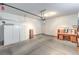 Spacious garage with storage cabinets and a workbench, ideal for projects and organization at 4725 Basilicata Ln # 204, North Las Vegas, NV 89084