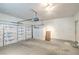Spacious garage with ample storage, including cabinets, and insulated garage door at 4725 Basilicata Ln # 204, North Las Vegas, NV 89084