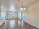 Open concept living room with wood floors, natural light and a sliding glass door at 4725 Basilicata Ln # 204, North Las Vegas, NV 89084