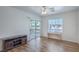 Bright living room with wood floors, a sliding glass door to the balcony and modern accents at 4725 Basilicata Ln # 204, North Las Vegas, NV 89084