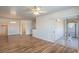 Spacious living room with wood floors, ceiling fan and sliding glass door to the balcony at 4725 Basilicata Ln # 204, North Las Vegas, NV 89084