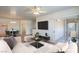 Bright living room features a sliding glass door and views into the dining area at 4725 Basilicata Ln # 204, North Las Vegas, NV 89084