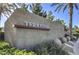 Community entrance sign for Terrasini, with lush landscaping and modern design at 4725 Basilicata Ln # 204, North Las Vegas, NV 89084