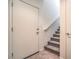 Stairway leads to the upper level of the home, featuring carpeted steps and a white railing at 4725 Basilicata Ln # 204, North Las Vegas, NV 89084