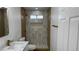 Updated bathroom featuring marble countertops and a step-in shower at 5239 Treasure Ave, Las Vegas, NV 89122