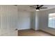 Bedroom featuring light-colored flooring, neutral walls, a ceiling fan, and a window for natural light at 5239 Treasure Ave, Las Vegas, NV 89122