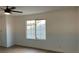 Bright bedroom featuring light-colored floors, neutral walls, and a large window that provides natural light at 5239 Treasure Ave, Las Vegas, NV 89122