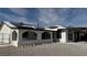 Charming home featuring an arched covered porch and solar panels on the roof at 5239 Treasure Ave, Las Vegas, NV 89122