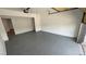 Spacious garage with epoxy flooring, high ceilings, an open door, and room for multiple vehicles at 5239 Treasure Ave, Las Vegas, NV 89122