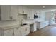 Bright kitchen with white cabinets, stainless steel appliances, and a long countertop at 5239 Treasure Ave, Las Vegas, NV 89122