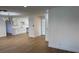 Open floor plan with new floors connects the kitchen and living areas with fresh paint at 5239 Treasure Ave, Las Vegas, NV 89122