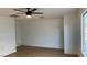 Spacious living room featuring light-colored flooring, neutral walls, and modern ceiling fan at 5239 Treasure Ave, Las Vegas, NV 89122