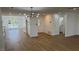 Open-concept living area featuring laminate flooring at 5239 Treasure Ave, Las Vegas, NV 89122