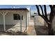 Covered patio area with open fenced access to the back alley at 5239 Treasure Ave, Las Vegas, NV 89122