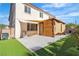 Enjoy outdoor living in this backyard with artificial grass, a covered patio, and space for relaxation at 5425 Pride Mountain St, North Las Vegas, NV 89031