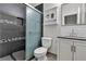 Stylish bathroom with a tiled shower, modern vanity, and contemporary fixtures at 5425 Pride Mountain St, North Las Vegas, NV 89031