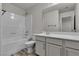 Bright bathroom with a combined shower and tub and white vanity at 5425 Pride Mountain St, North Las Vegas, NV 89031