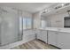 Bathroom with double sink vanity, shower, and tub combination at 5425 Pride Mountain St, North Las Vegas, NV 89031