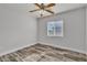 Well-lit bedroom with hardwood floors and a window at 5425 Pride Mountain St, North Las Vegas, NV 89031