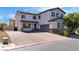 Charming two-story home featuring a brick driveway and meticulously maintained landscaping at 5425 Pride Mountain St, North Las Vegas, NV 89031